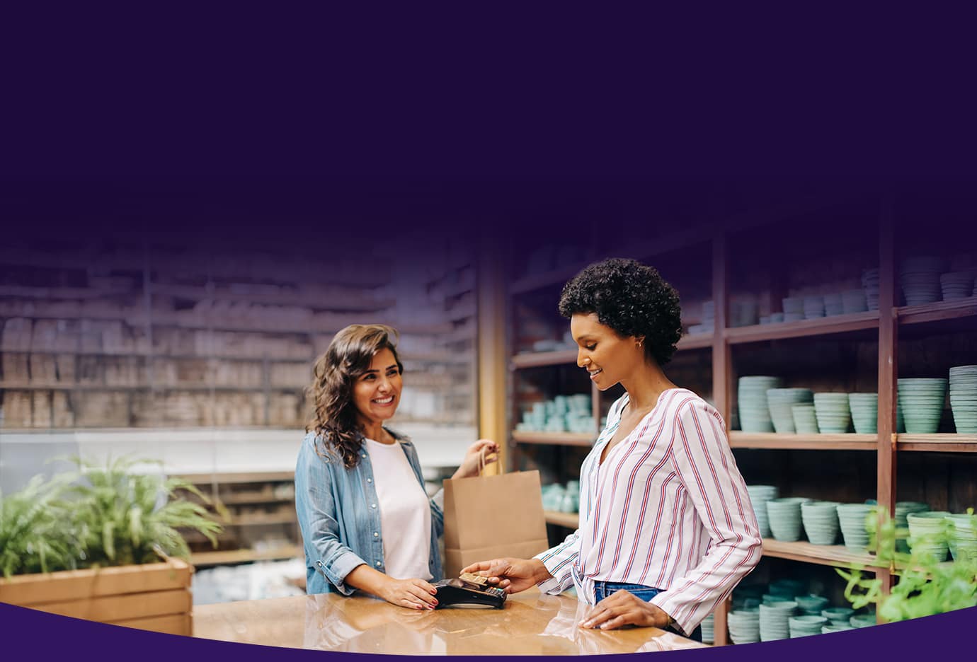NMI company image of a merchant accepting card payment
